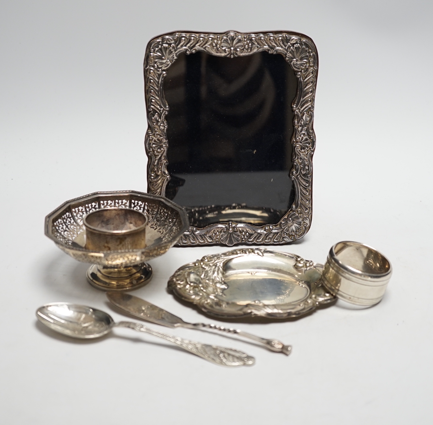 Sundry small silver and plate including a mounted photograph frame, napkin ring bonbon dish, plated butter knife, etc.